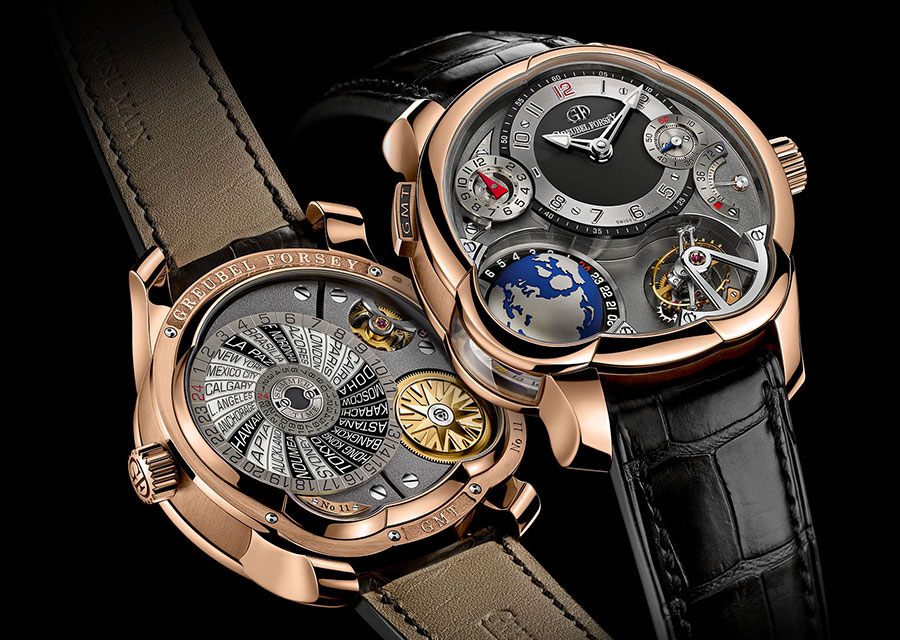 Greubel Forsey GMT Tourbillon : or rouge, Diamètre : 43,5 mm, Verre saphir, Poussoir GMT, Cadran multi-niveaux en or, Tourbillon incliné à 25°, une rotation en 24 secondes, Compteur 12 heures pour le second fuseau (aiguille triangle rouge), Indicateur de réserve de marche (72 heures), Fond avec verre saphir bombé asymétrique, Calibre à remontage manuel avec disque 24 villes (UTC et heure d’été), Soleil en or gravé, Bracelet en alligator noir, Etanchéité : 30 m.